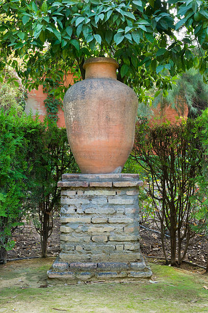 istock Garden urn on a large brick stand 454970329