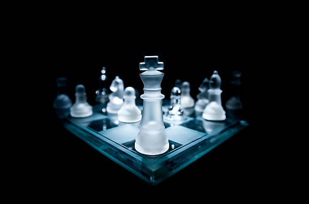 King of Chess A picture of the king chess piece on a glass chess board. Shot with one light. chess board photos stock pictures, royalty-free photos & images