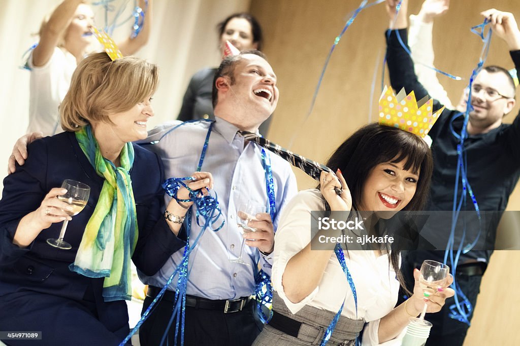 Party time Group of mixed age people in formalwear having fun at the party. 50-59 Years Stock Photo