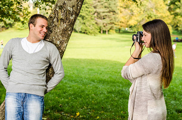 istock Happy young couple enjoying in the park 454971293