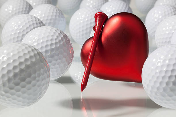istock Many golf balls and red heart 454975481