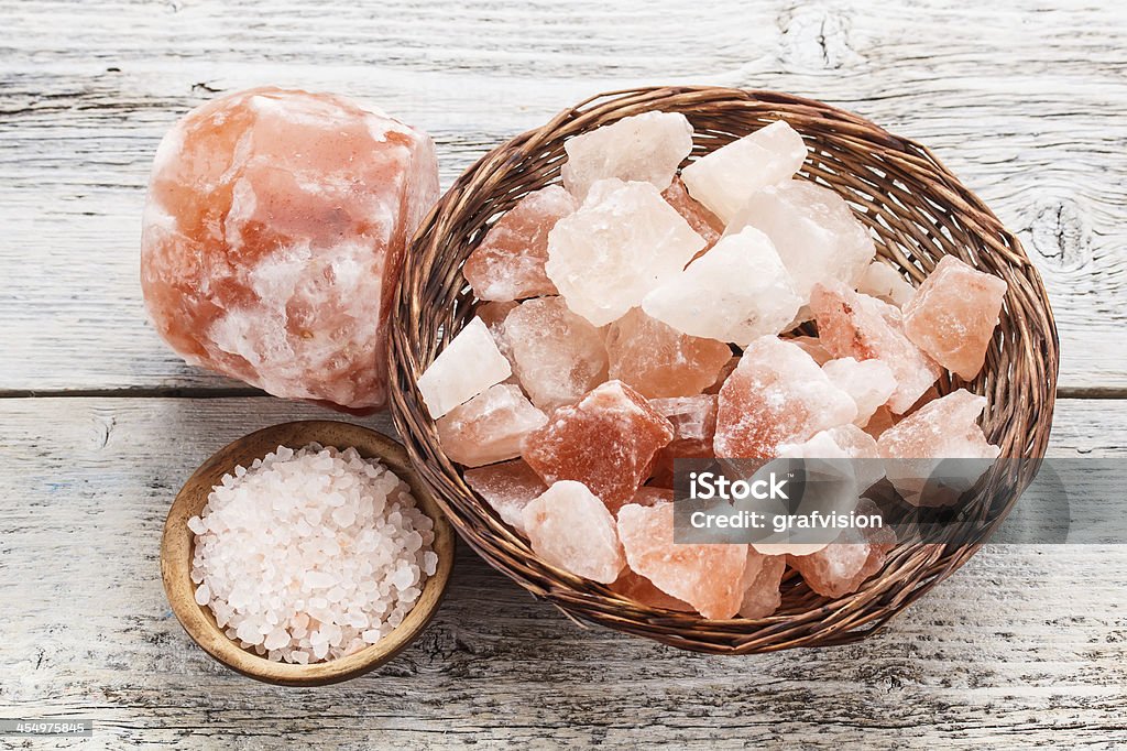 Himalayan pink salt Himalayan pink salt in wicker basket Alternative Therapy Stock Photo