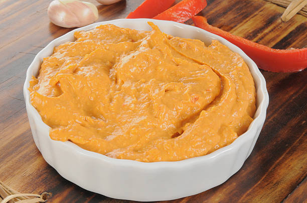 istock Garlic and red pepper hummus 454976847