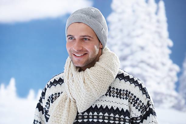 istock Winter portrait of happy young man 454977357