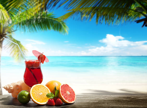 istock strawberry cocktail and tropical fruit on the beach 454983669