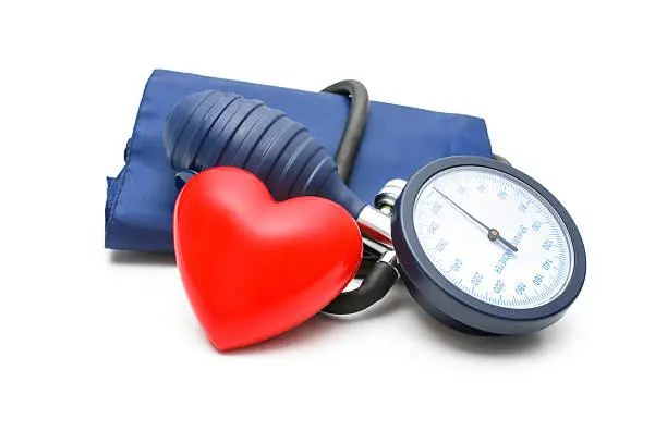 Blood Pressure gauge and heart isolated on white background