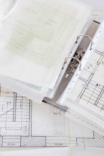 istock Architectural plans of old paper and file with the project 454985191