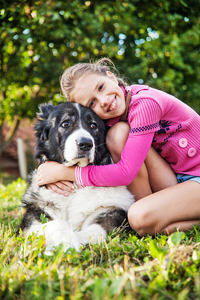 istock Girl playing with her  dog 454986055