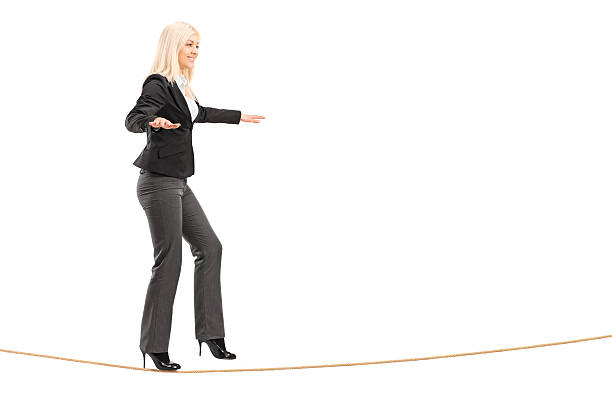istock Young woman walking on a rope 454986229