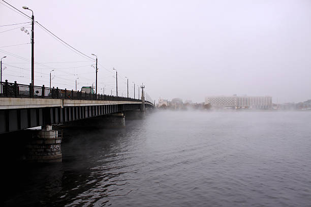 Akmens Bridge over Daugava River at fogy day in Riga