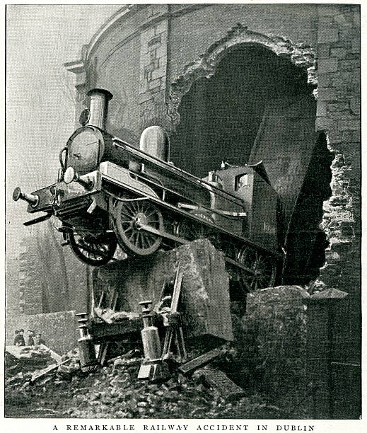 Railway Accident, Dublin Vintage engraving from 1900 of a Railway Accident, Dublin, Ireland.  A cattle train, consisting of an engine and 26 waggons, rushed through the station at great speed, the engine striking the displacing the buffers and stop bank, and breaking through the end wall into Hatch Street. derail stock illustrations