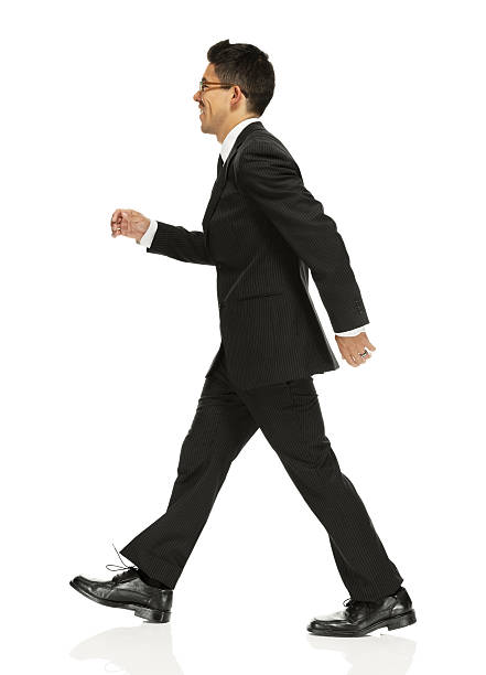 istock Cheerful businessman walking 454993637