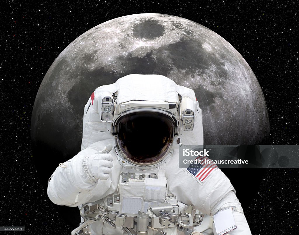 Astronaut in space giving thumbs up to moon Astronaut in space giving thumbs up to moon. This stock image has a horizontal composition. Astronaut Stock Photo
