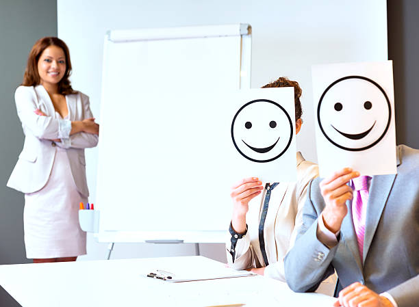 istock Business team holding happy smile sign 454996555