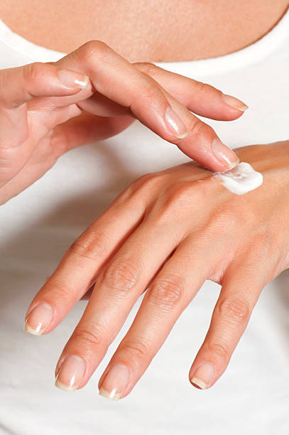 istock Female hands applying hand cream 454997711