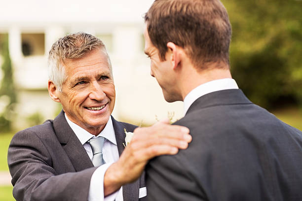 istock Man Keeping His Hand On Groom's Shoulder In Garden 454998457