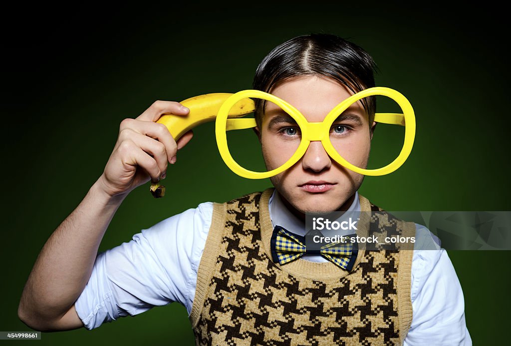 suicide funny nerd shooting himself with banana. Fun Stock Photo