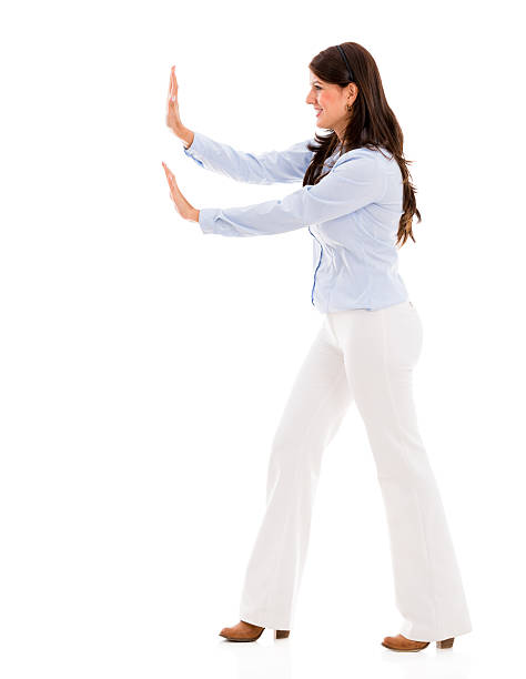 istock Business woman pushing something 454999329