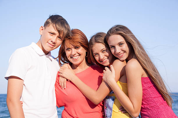 istock Happy family resting at beach in summer 455002775