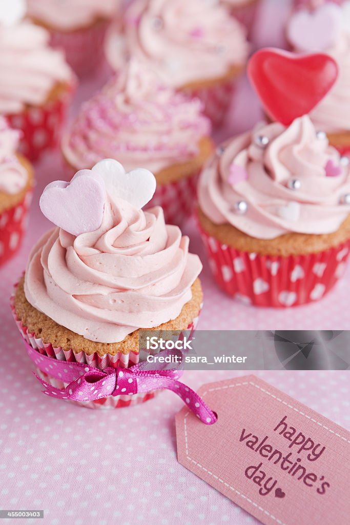 Pink Valentine cupcakes with the words 'Happy Valentines day' Sweet pink Valentine cupcakes. Valentine's Day - Holiday Stock Photo