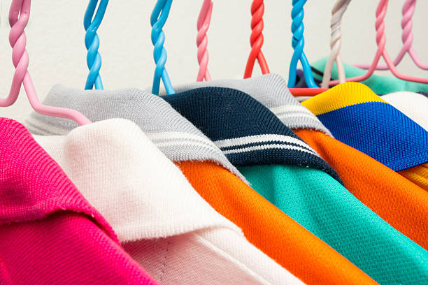 istock Colorful T-shirts on hangers 455011637