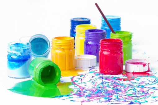 Used and spilled plastic paint bottles