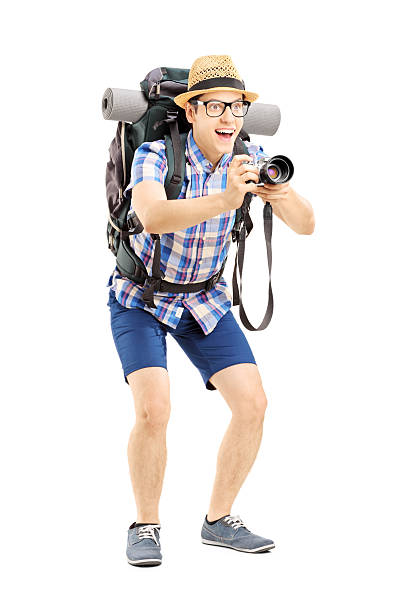 istock Male tourist with backpack taking a picture 455012983