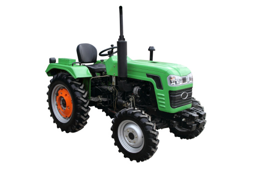 Green tractor separately on a white background