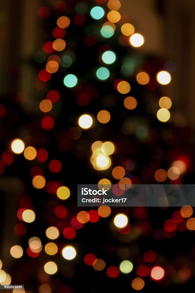 Glow blurred lights of Christmas tree Glowing blurred colorful circles lights of Christmas tree. Bokeh effect. Christmas Tree Stock Photo