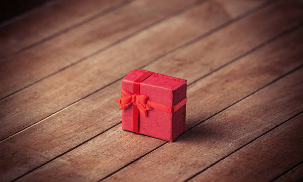 istock Little gift on wooden table. 455075059