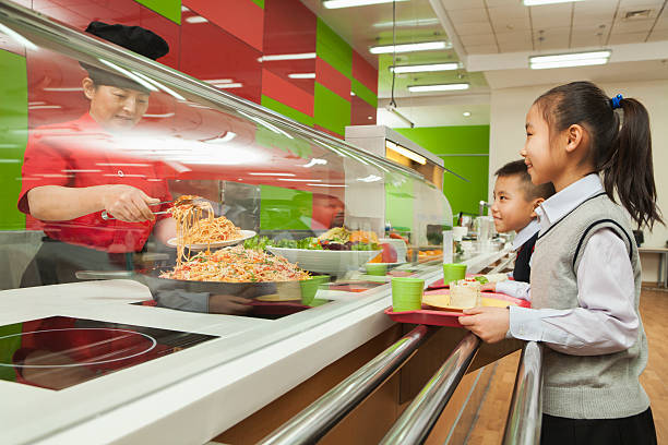 istock Children standing in line at school cafeteria 455075161