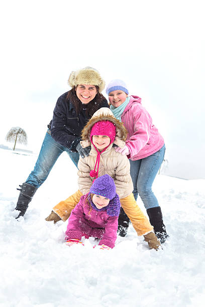 istock Happy family enjoying in winter 455076315