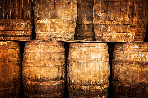 istock Stacked whisky and wine barrels in vintage style 455076849