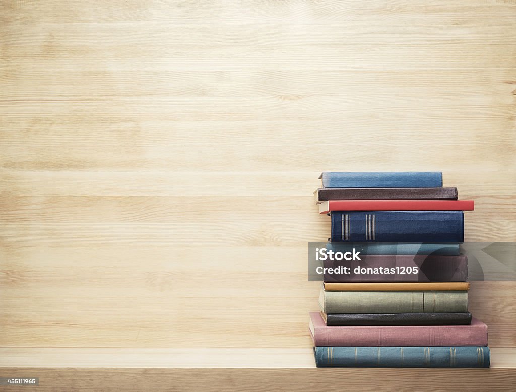 Books Old books on a wooden shelf. Ancient Stock Photo