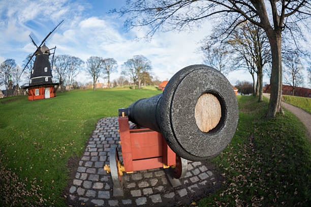 istock Cannon and windmill in Copenhagen Citadel - Kastellet 455111981