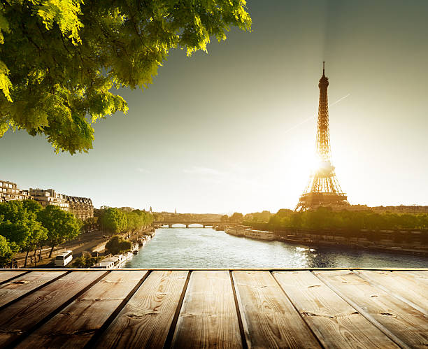 istock background with wooden deck table and  Eiffel tower in Paris 455113271