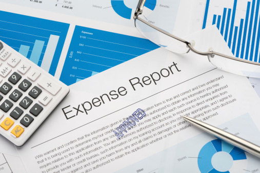 Approved expense report with paperwork