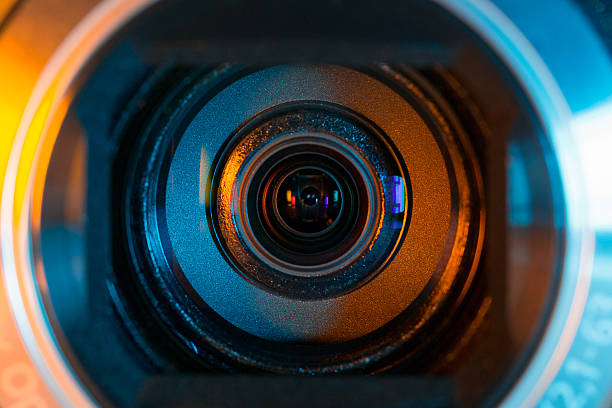 istock Close-up of a video camera lens as a background 455143989
