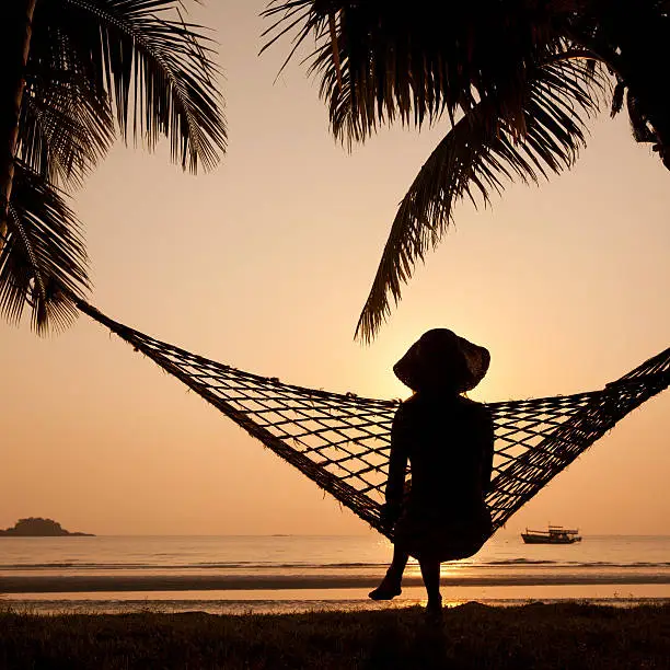 Photo of silhouette of woman in hammock