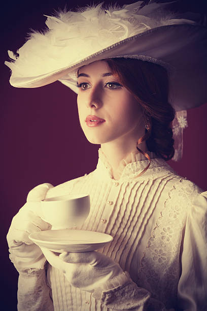 istock Beautiful redhead women with cup of tea 455164203
