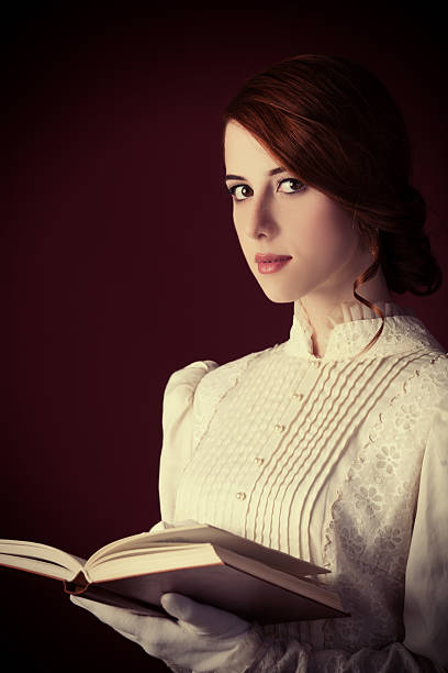 Beautiful redhead women with book