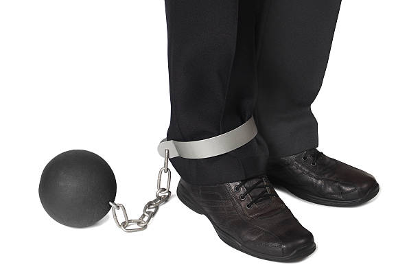 istock Businesman with ball and chain 455165249