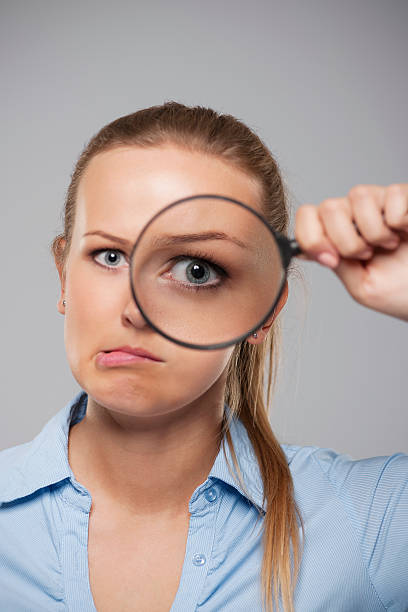 istock Blonde businesswoman with big eye 455166329