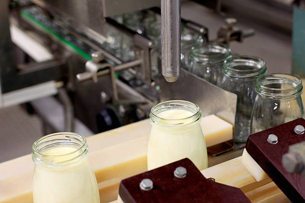 istock Conveyor bottles  with milk products 455169033