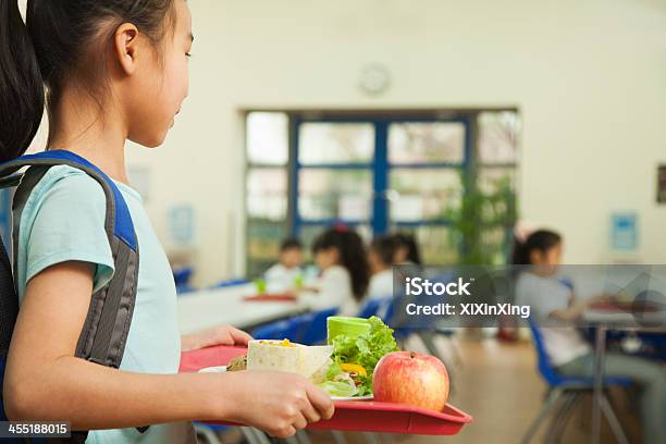 Girl Holding Food Tray In School Cafeteria Stock Photo - Download Image Now - School Lunch, Cafeteria, School Building