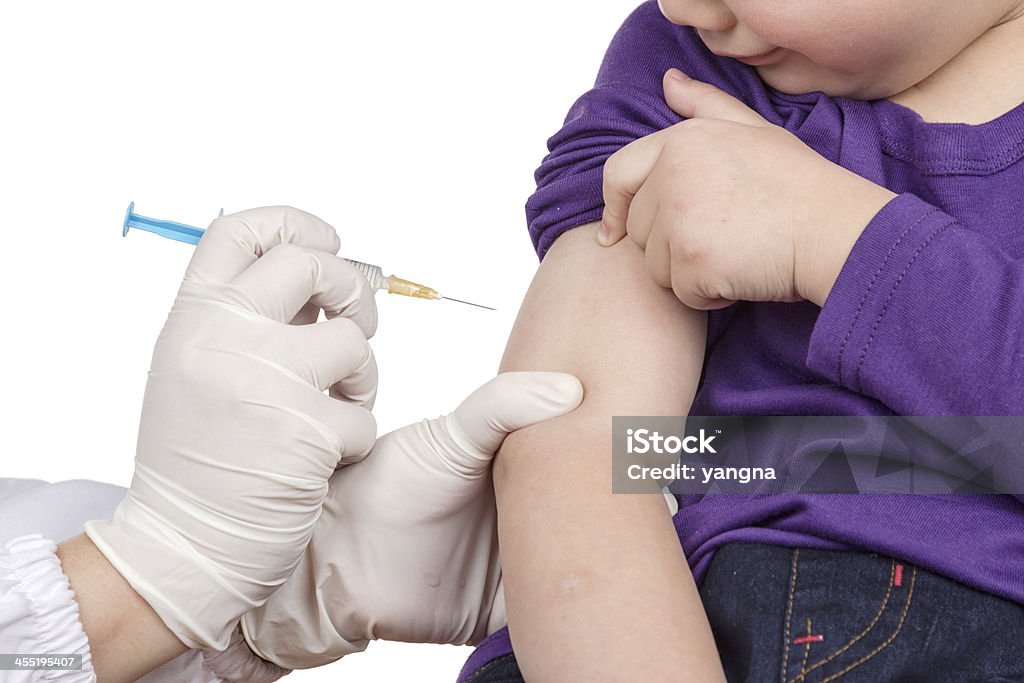 The doctor gave children vaccination needle Vaccination Stock Photo