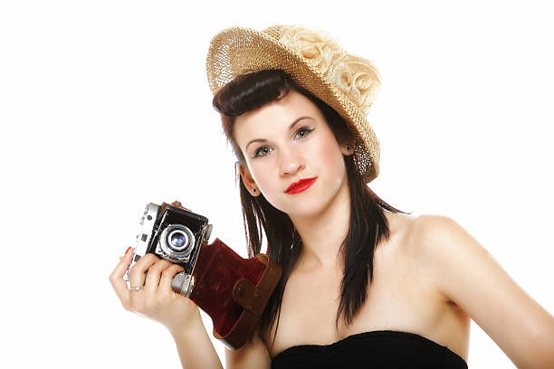 istock Pretty retro girl in hat with vintage camera 455196967