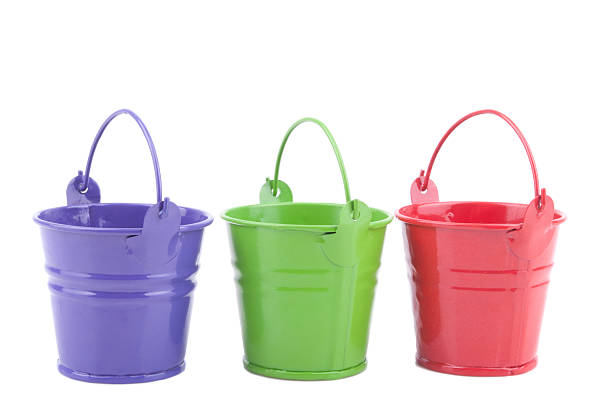 istock Three buckets of different colors, isolated on white background. 455204313