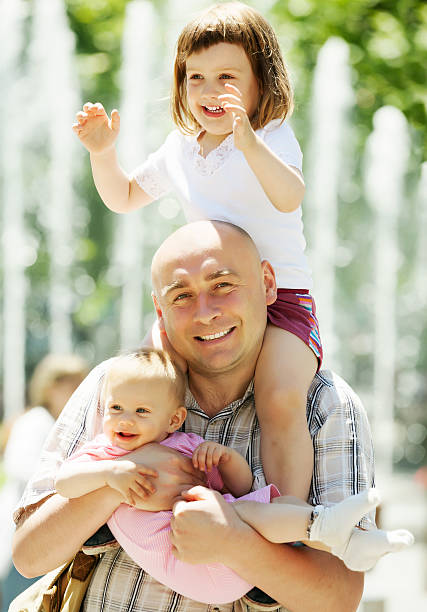 istock happy father with two children 455212575