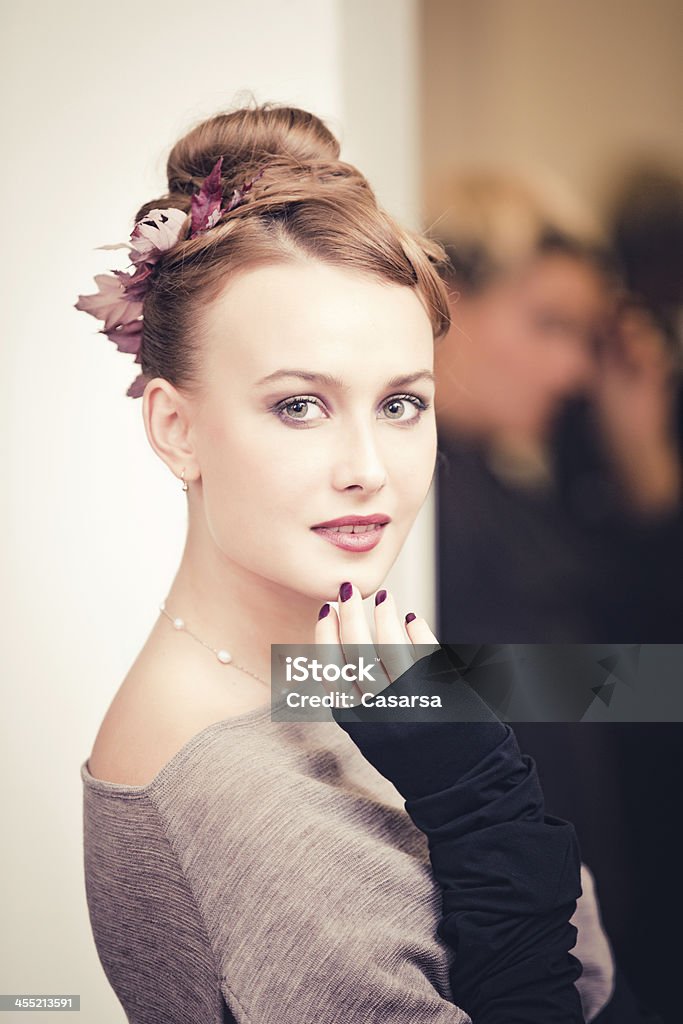 Beautiful woman portrait Beautiful woman portrait indoors with an autumn hairstyle, ornated with dry leaves. 20-24 Years Stock Photo